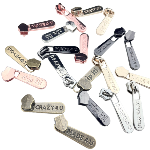 Just for you! #5 Sewciopath zipper pulls displayed, one of each 5 colors available in nickel, gold, rose, antique, and gunmetal