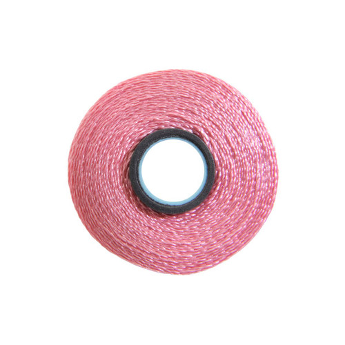 Close-up of a Glide 40 weight polyester thread bobbin in Pink, size L, with 72 yards of thread.
