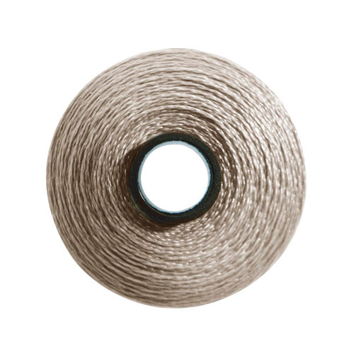 Close-up of a Glide 40 weight polyester thread bobbin in Warm Grey 4, size M, with 132 yards of thread.