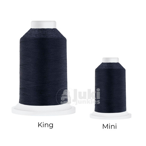 Close-up of two Cairo Quilt 50 weight Egyptian cotton thread spools in Navy, showing a soft, matte finish. A large King spool (3,000 yards) and a smaller Mini spool (670 yards) are side by side for size comparison.
