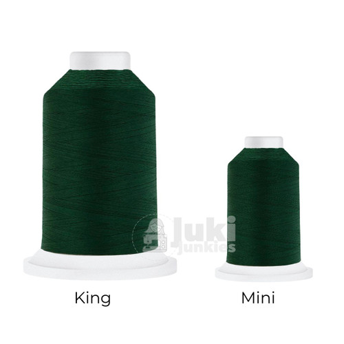 Close-up of two Cairo Quilt 50 weight Egyptian cotton thread spools in Totem Green, showing a soft, matte finish. A large King spool (3,000 yards) and a smaller Mini spool (670 yards) are side by side for size comparison.