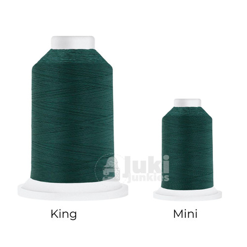 Close-up of two Cairo Quilt 50 weight Egyptian cotton thread spools in Persian, showing a soft, matte finish. A large King spool (3,000 yards) and a smaller Mini spool (670 yards) are side by side for size comparison.