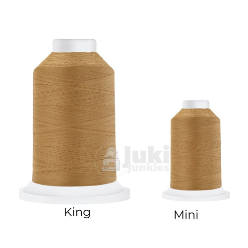 Close-up of two Cairo Quilt 50 weight Egyptian cotton thread spools in Khaki, showing a soft, matte finish. A large King spool (3,000 yards) and a smaller Mini spool (670 yards) are side by side for size comparison.