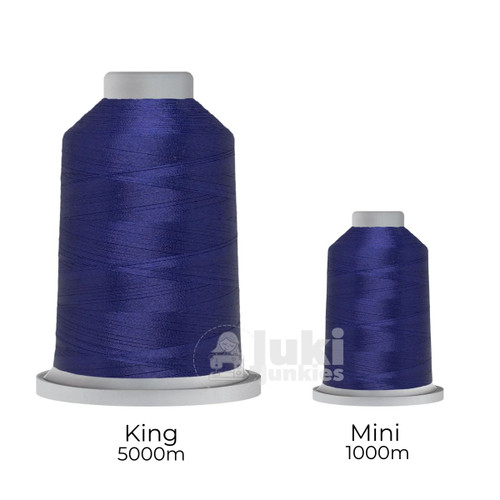 Close-up of two spools of Glide 40 weight polyester thread in Lightning: a large King spool (5,500 yards) and a smaller Mini spool (1,100 yards), shown side by side for size comparison, with a smooth texture and noticeable sheen.