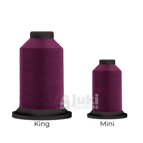 Close-up of two Premo-Soft 50 weight polyester thread spools in Violet, showing a soft, matte texture. A large King spool (3,000 yards) and a smaller Mini spool (670 yards) are side by side for size comparison.