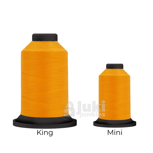 Close-up of two Premo-Soft 50 weight polyester thread spools in Marigold, showing a soft, matte texture. A large King spool (3,000 yards) and a smaller Mini spool (670 yards) are side by side for size comparison.