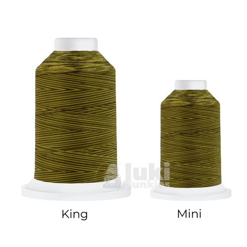 Close-up of a 500-yard spool of Harmony 40 weight variegated thread in shades of yellow and brown, highlighting the color variations and matte finish.