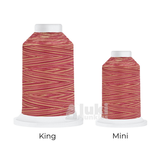 Close-up of a 500-yard spool of Harmony 40 weight variegated thread in shades of red, pink, orange, and yellow, highlighting the color variations and matte finish.