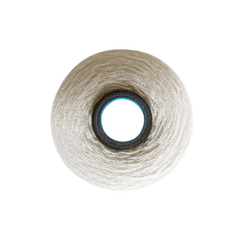 Close-up of a Magna-Quilt 50 weight cotton bobbin, size L, in {Cream, with 74 yards of thread.