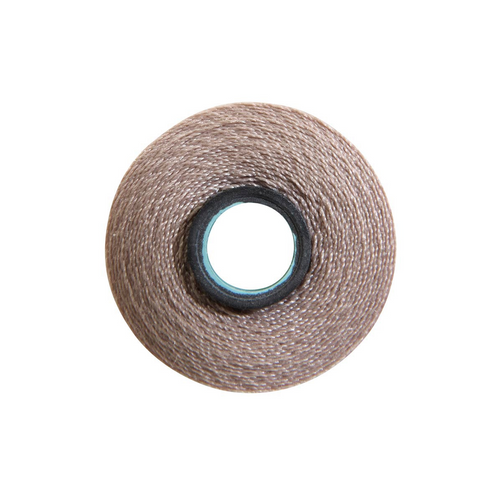 Close-up of a Magna-Quilt 50 weight cotton bobbin, size L, in Light Tan, with 74 yards of thread.