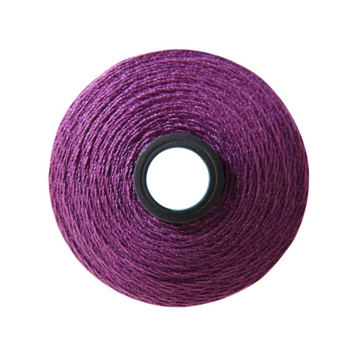 Close-up of a Magna-Quilt 50 weight cotton bobbin, size M, in Violet, with 132 yards of thread.