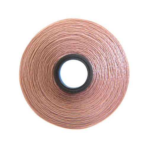 Close-up of a Glide 60 weight polyester bobbin in Tuscan, size M, with 210 yards of fine thread.