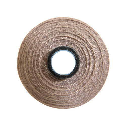 Close-up of a Magna-Soft 50 weight polyester bobbin, size M, in Light Tan, holding 118 yards of thread.