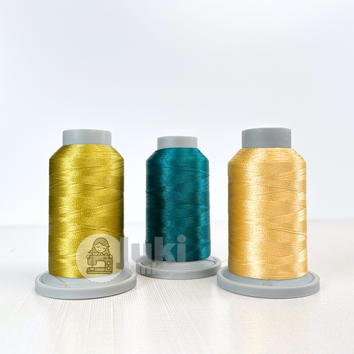 Shades of Prickly Pear, Buttermilk, Teal in Glide 40w mini spools of 1100yd spools