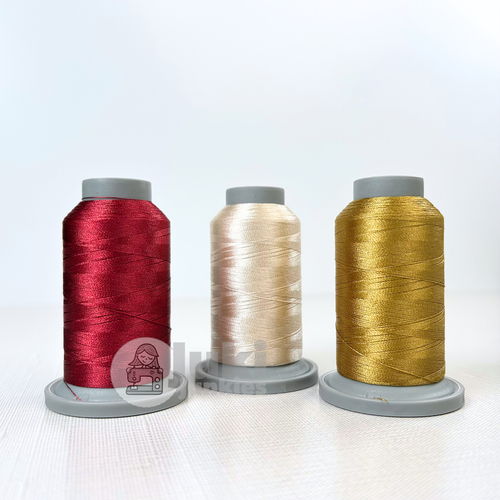 Shades of Light Burgundy, Pearl, Ginger in Glide 40wt. mini spools of 1100yd spools