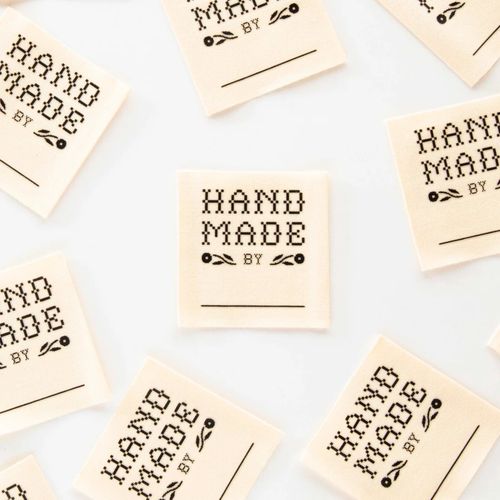 all four labels saying handmade by scattered on table