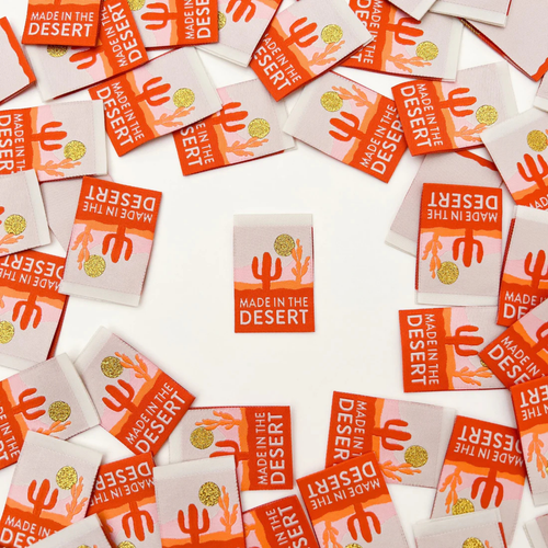 scattered made in the Desert labels on a table 