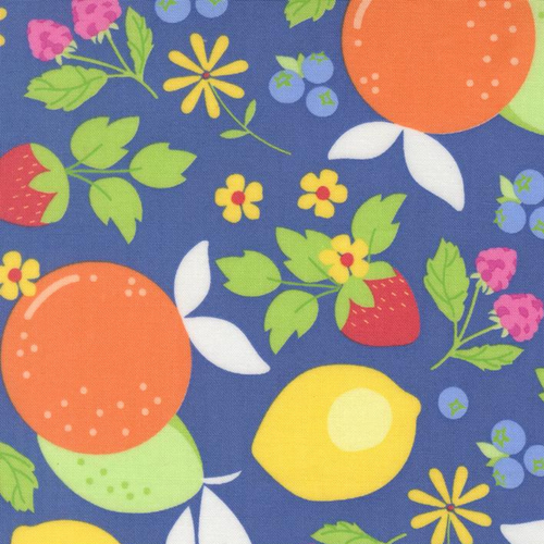 Close up of fabric with various fruits and flowers on a deep blue background