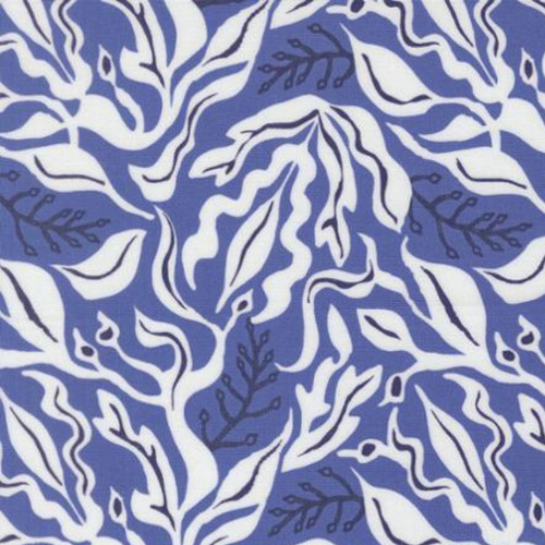 Close up of fabric with a white leafy pattern on a blue background