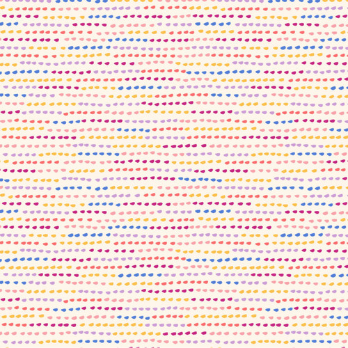 Close up of fabric with a dotted line pattern in rainbow on a cream background