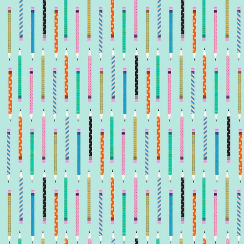 Close up of fabric with various pencils on an aqua blue background