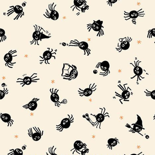Close up of fabric with black spiders and small orange spiders on a cream colored background