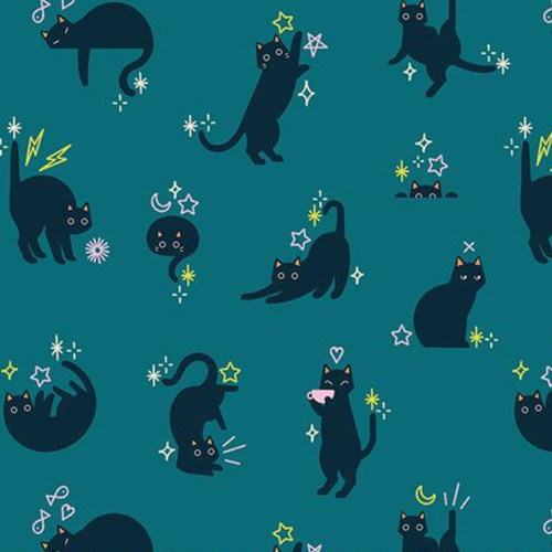 Close up of fabric with black cats, stars, and lightning bolts on a teal background