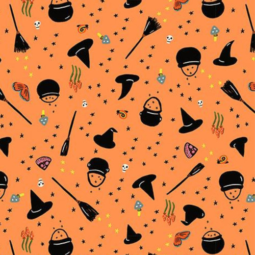 Close up of fabric with witch hats, trick-or-treat baskets, brooms, stars, butterflies, and mushrooms on an orange background