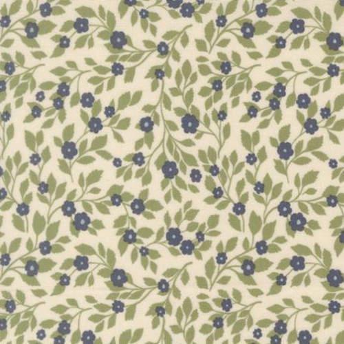 Close up of fabric with tossed blue flowers on a cream colored background