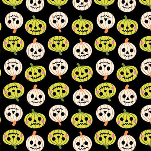 Close up of fabric with white and green pumpkins on a black background