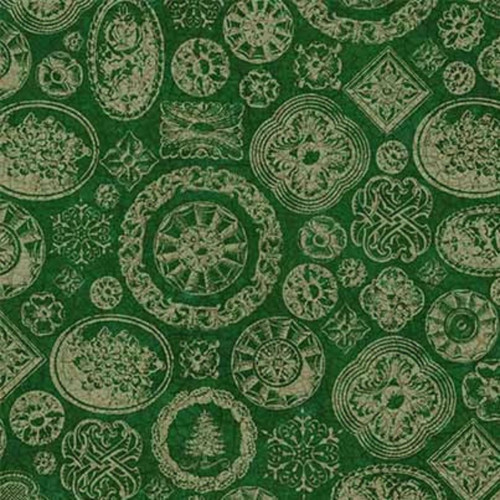 Close up of fabric with various holiday stamps on a dark green background