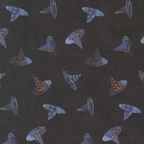 Close up of fabric with various with hats on a black background 