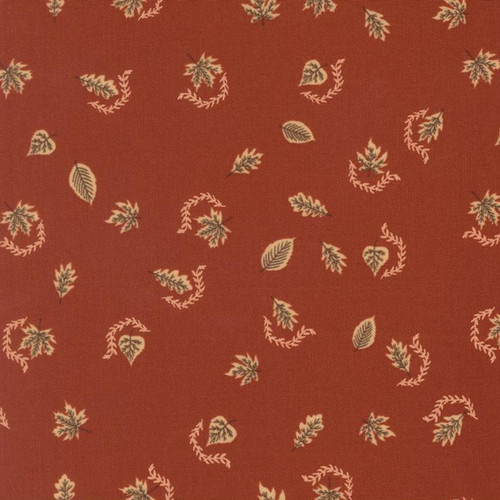 Close up of fabric with autumn leaves falling on a dark red background