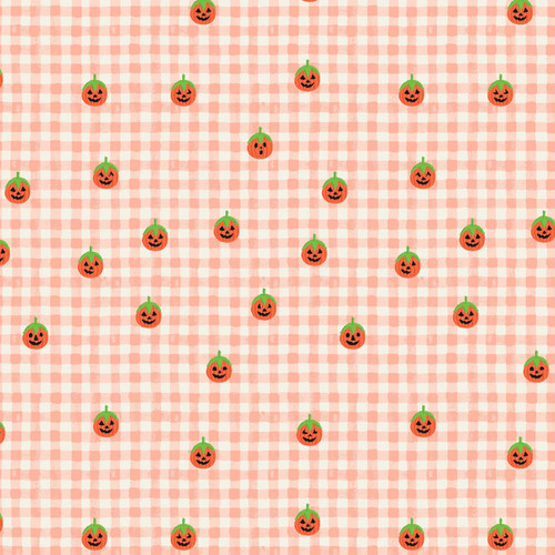 Close up of fabric with tiny orange pumpkins on a blush pink and white gingham background 