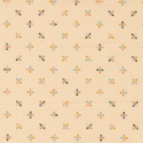 Close up of fabric with a colorful abstract floral pattern on a beige colored background