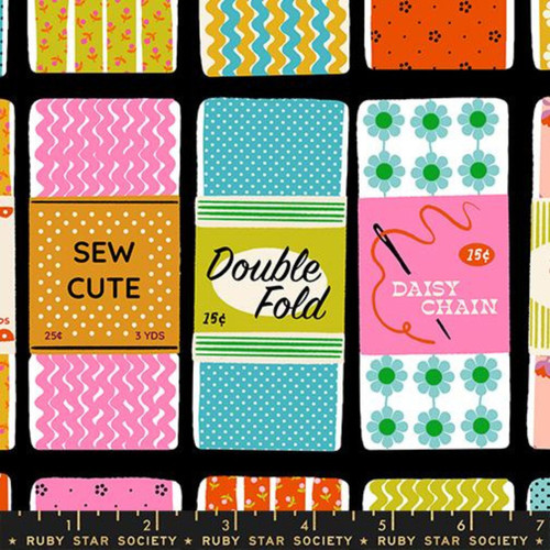 7inch by 7inch of fabric with rectangles that have sewing-related text such as "SEW CUTE", "Double Fold", "Daisy Chain" on a black background.