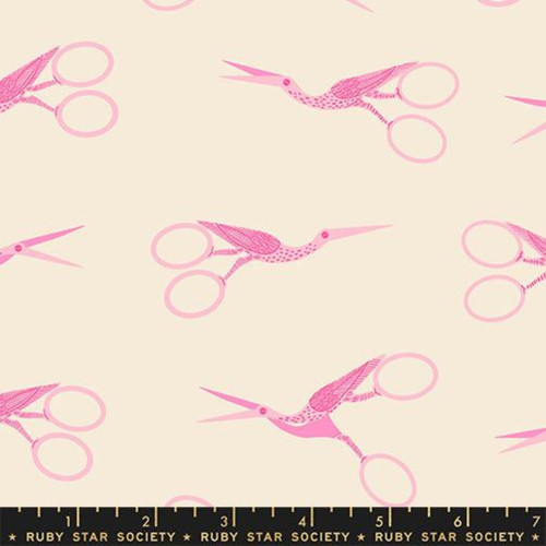 7inch by 7inch of fabric with stork scissors in pink on a beige background