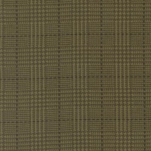 Close up of fabric with a plaid print in dark green