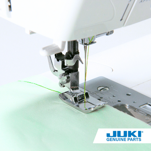 Juki straight stitch presser foot in use on a computerized sewing machine, stitching a precise seam with center needle position and front guidelines for accurate 0.1-0.3 inch spacing