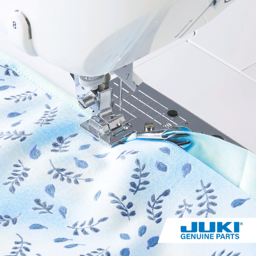 Juki binder presser foot for computerized machines, folding bias tape into double-fold edges about 0.2 inch wide and sewing it to fabric with an adjustable guide for precise binding.