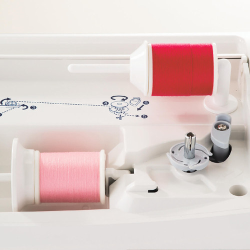 Auxiliary Spool Pin set up on a computerized machine, holding a second spool of thread for twin needle sewing.