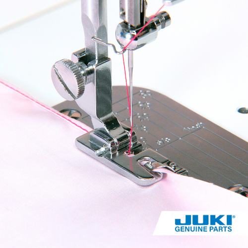 Hemming foot on a TL high shank machine, rolling and stitching fabric edge into a narrow 3 millimeter double fold hem for napkin, ruffles and handkerchief edges