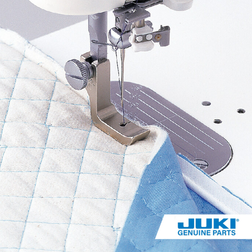 Piping foot on a TL high shank machine, stitching piping into a fabric edge with the 3-millimeter groove guiding cord. Use for bags, cushions and pillows.