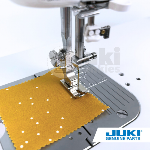 Juki hinged 1/4 inch foot on a TL high shank machine, piecing patchwork with a true 1/4 inch seam allowance by following the right edge of the foot