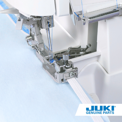 Juki elasticator presser foot on an MO series serger, overlocking fabric edge while stretching and sewing elastic tape through the front roller guide with adjustable tension.