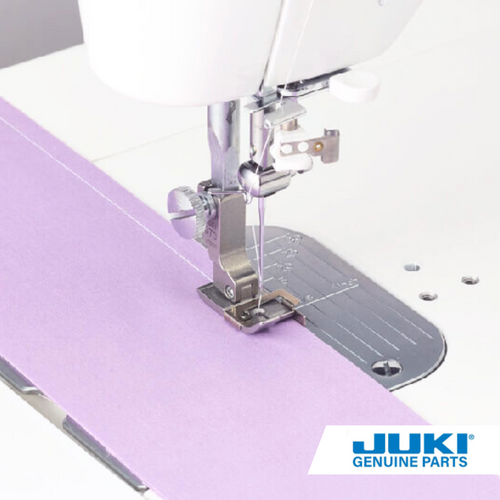 Juki 7 millimeter presser foot with guide on a TL high shank machine, piecing patchwork with a 7 millimeter seam allowance common in European patterns, ideal for thin to medium weight fabrics.