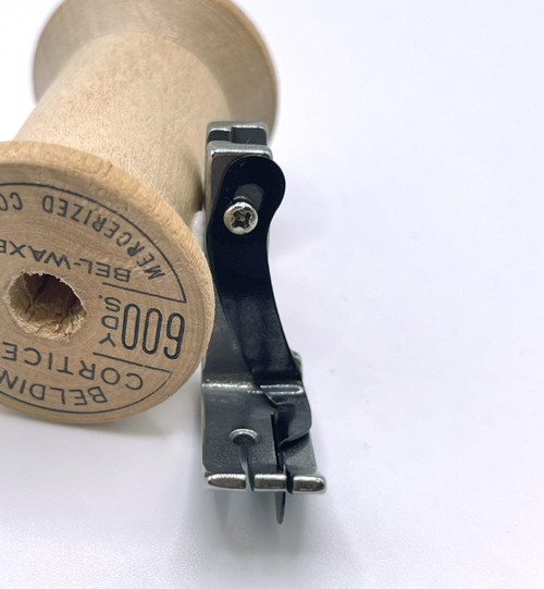 Front view of one eight inch top stitch foot with guide for industrial high shank machines