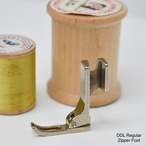 Metal hinged zipper foot for Juki industrial and TL high shank machines.