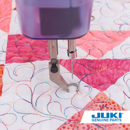 Side open toe foot on a Juki longarm machine, providing clear side visibility for precise free-motion quilting and detailed stitch work