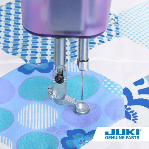 Couching foot set on a longarm machine, quilting with decorative yarn on a quilt, using one of the two included foot sizes to add textured dimension to the project.